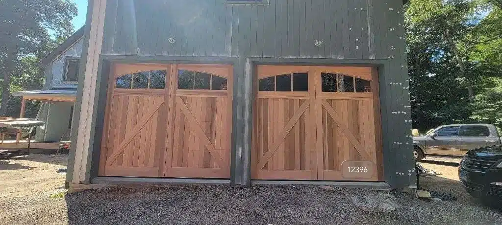 Artisan Western red cedar garage door in a natural finish installed by Ace Overhead Doors in Stonington, CT.