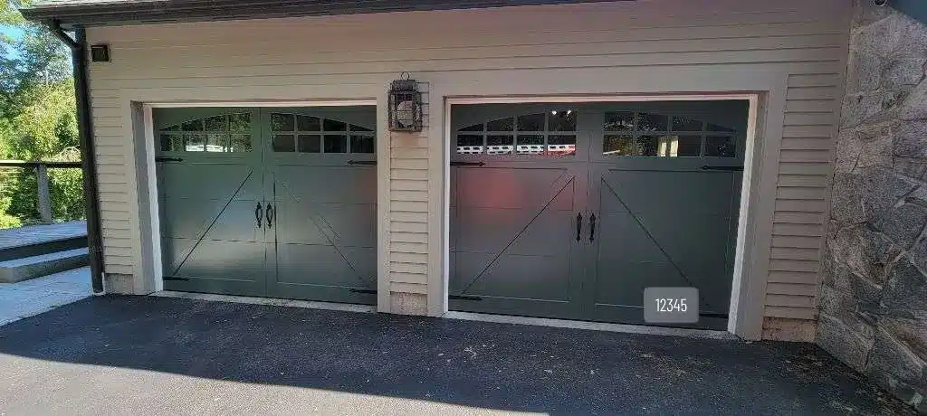Two sage green Fimbel American Legend garage doors with McCormick panels installed in East Lyme, CT.