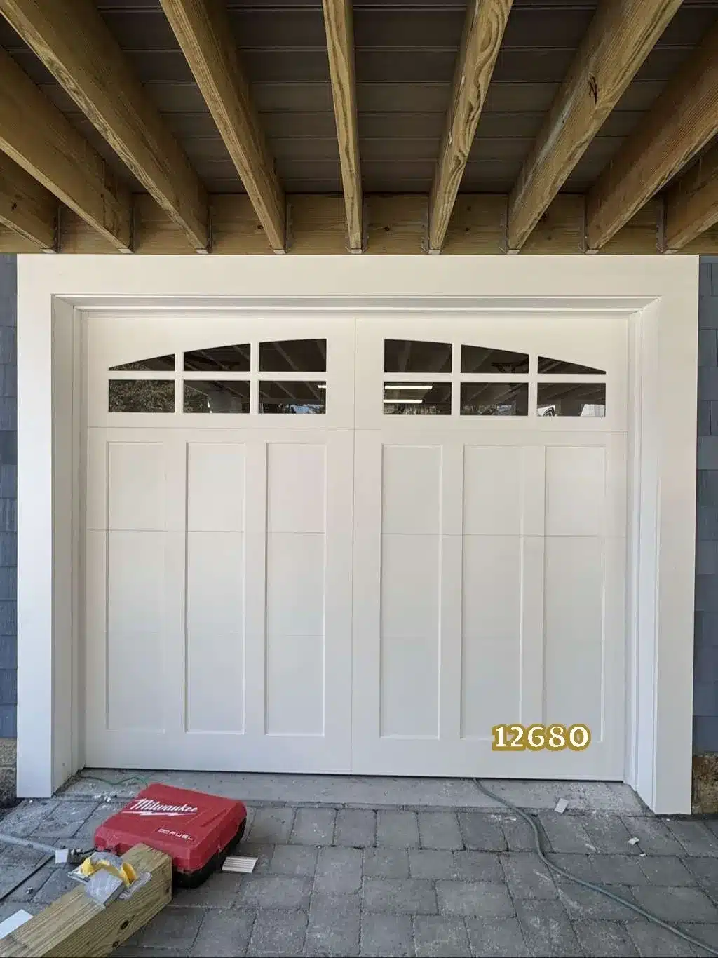 A white Fimbel American Legends garage door professionally installed at a residential property in Waterford, Connecticut, by Ace Overhead Doors.