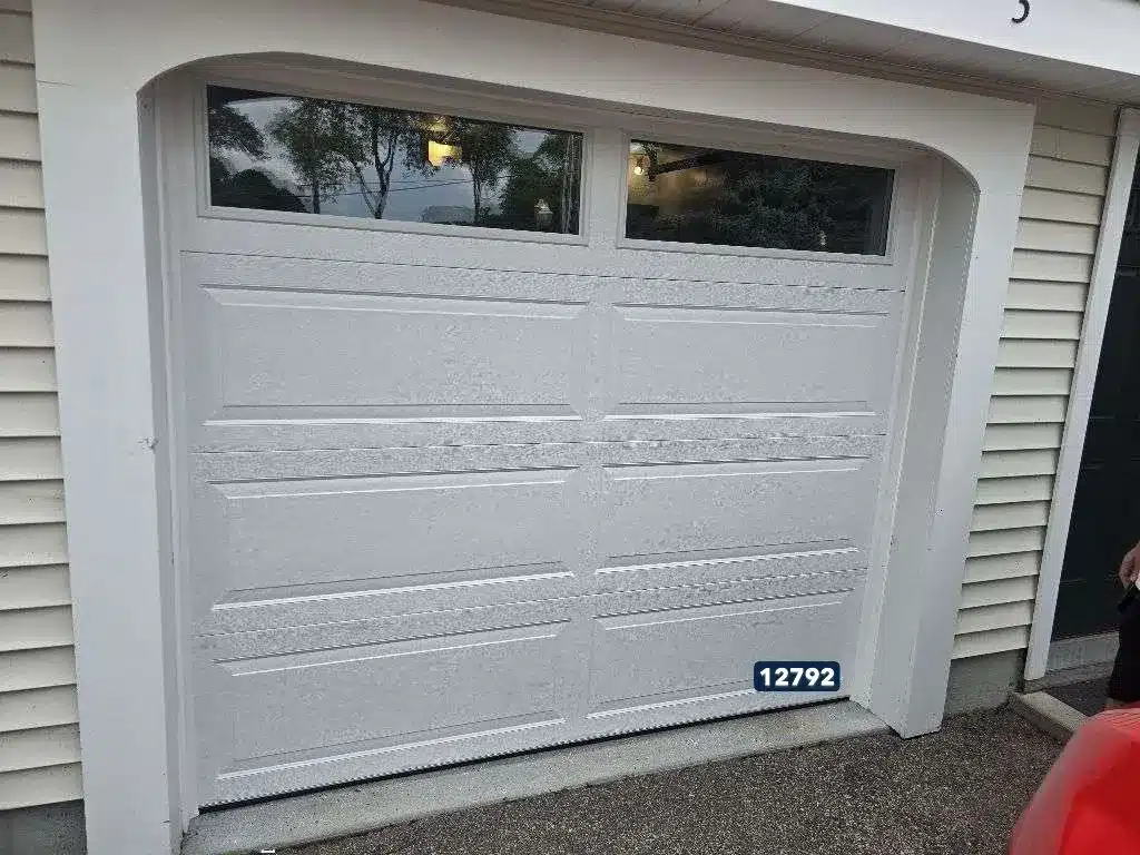 Explore a white Standard Newport 200 garage door installed by Ace Overhead Doors in Pawcatuck, CT, offering classic style and reliable performance.