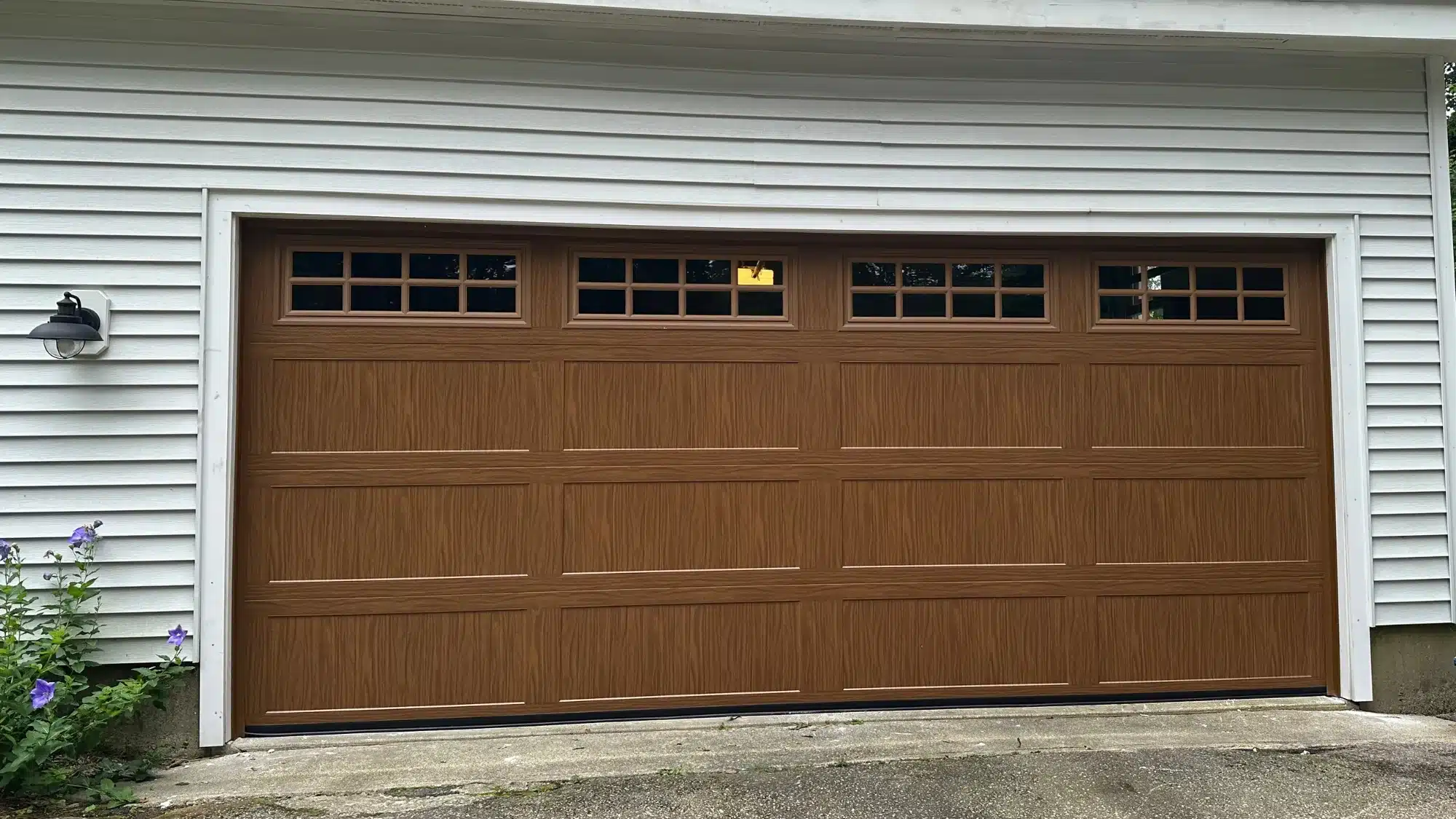 Ace Garage Door team repairing garage doors in Mystic, Connecticut.