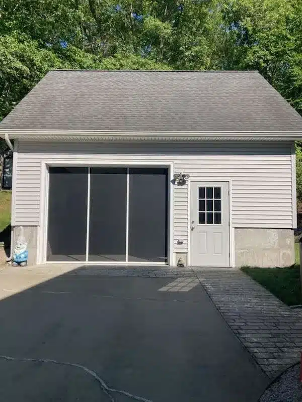Overhead screen installation featuring a Lifestyle Screen in Westerly, RI, by Ace Overhead Doors.